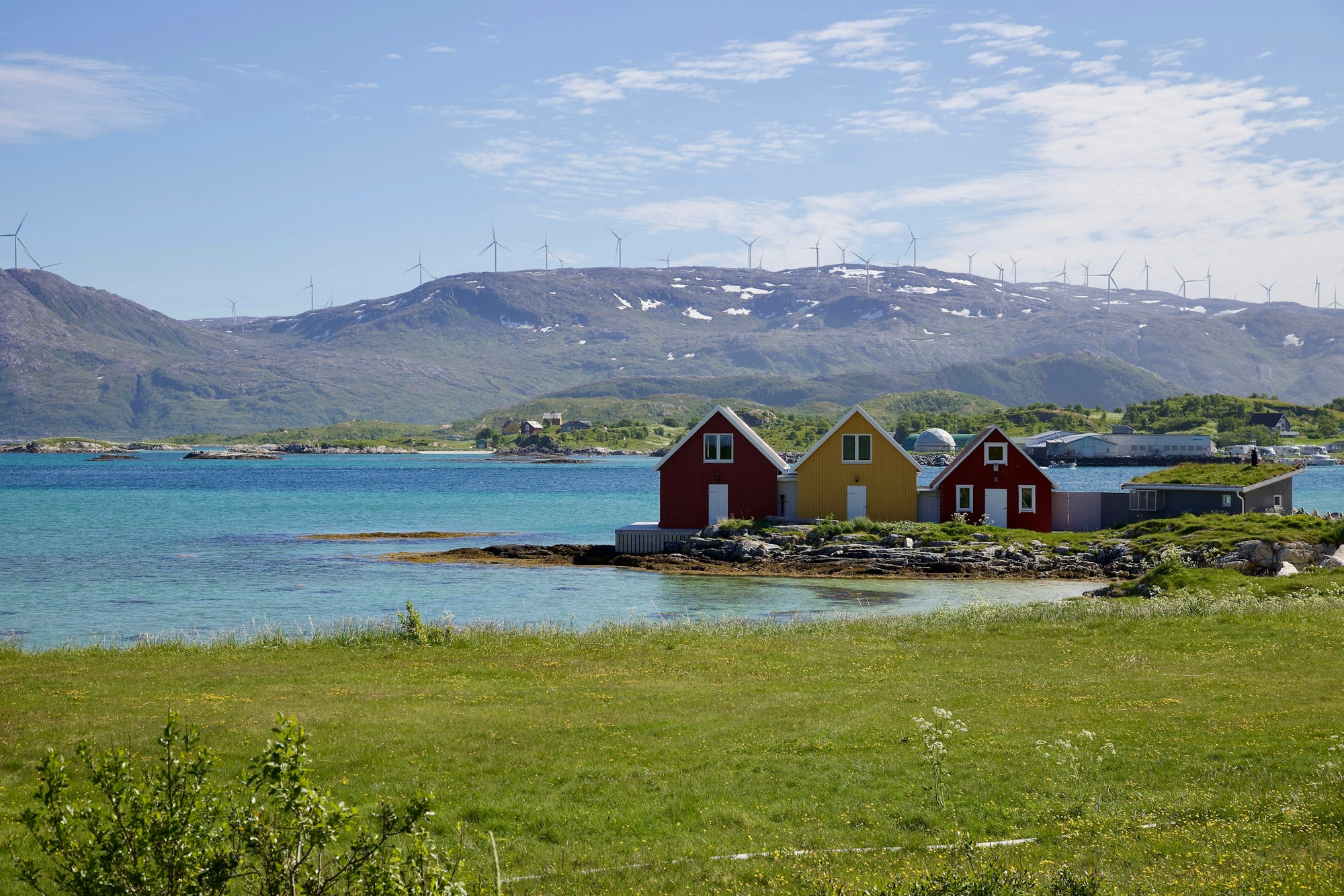 a group of houses by a body of water